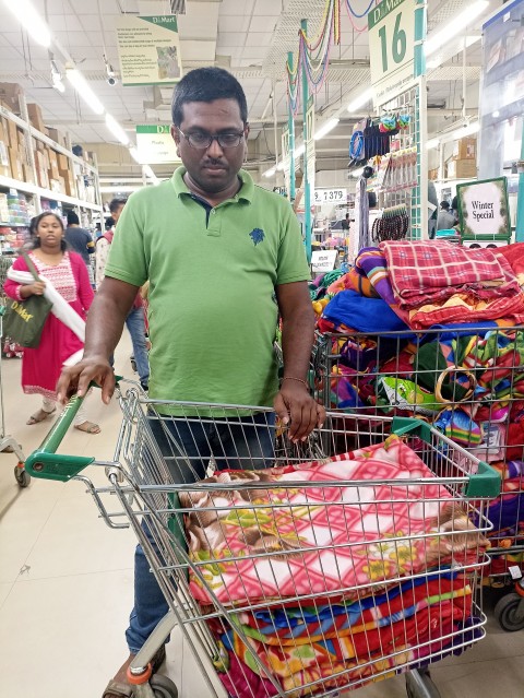 Volunteer buying blankets at D-Mart